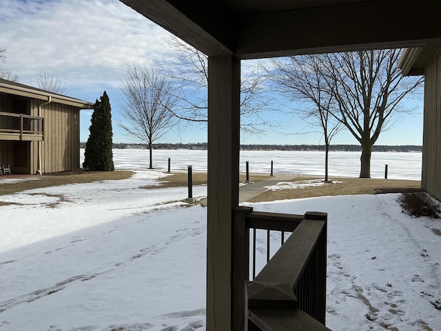 view of yard layered in snow