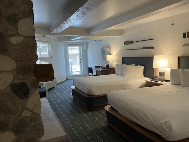 bedroom featuring beam ceiling