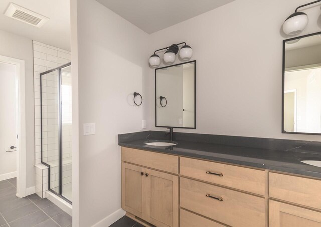 600 E Verleen Ave, Waunakee, WI 53597 - bathroom featuring a sink, visible vents, a shower stall, and double vanity