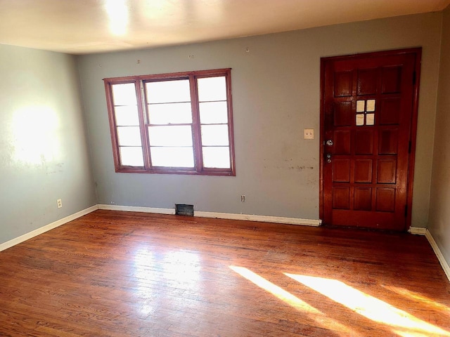 foyer entrance with dark hardwood / wood-style flooring