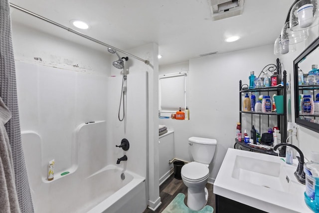 full bathroom featuring vanity, toilet, tub / shower combination, and hardwood / wood-style floors