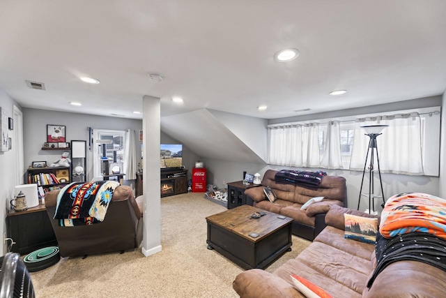 carpeted living room featuring a fireplace