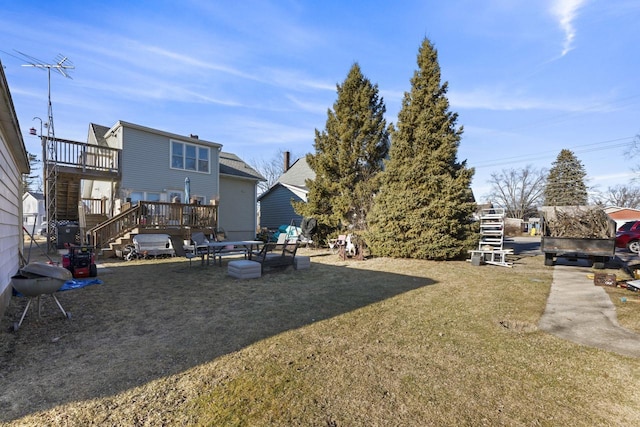 view of yard with a wooden deck