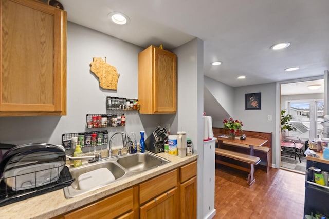 kitchen with sink and hardwood / wood-style floors