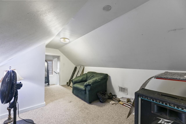 interior space with lofted ceiling and light colored carpet