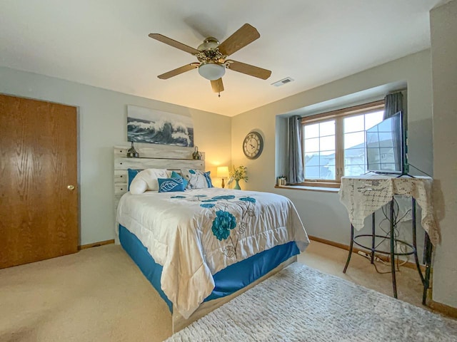 bedroom with ceiling fan and carpet floors