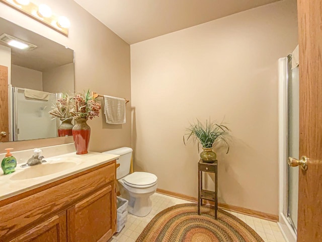 bathroom with walk in shower, vanity, and toilet