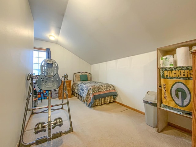 bedroom with lofted ceiling and carpet flooring