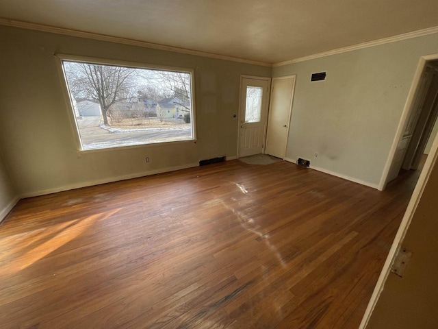 entryway with crown molding and dark hardwood / wood-style floors