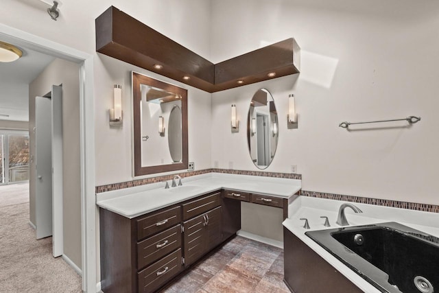 bathroom with vanity and a tub to relax in