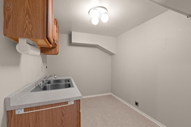 kitchen with sink and light carpet