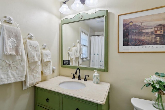 full bathroom with vanity and toilet