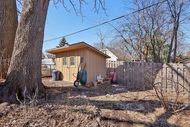 view of shed featuring a fenced backyard