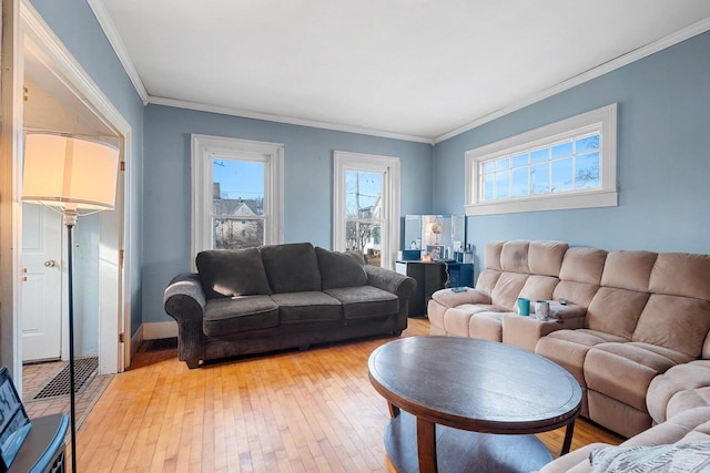 living room with ornamental molding and light wood-type flooring