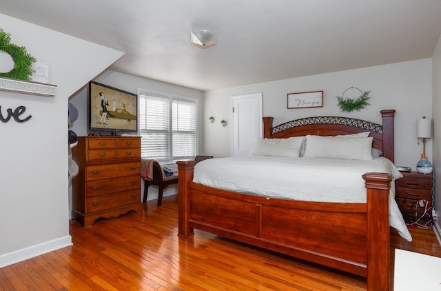 bedroom with hardwood / wood-style floors