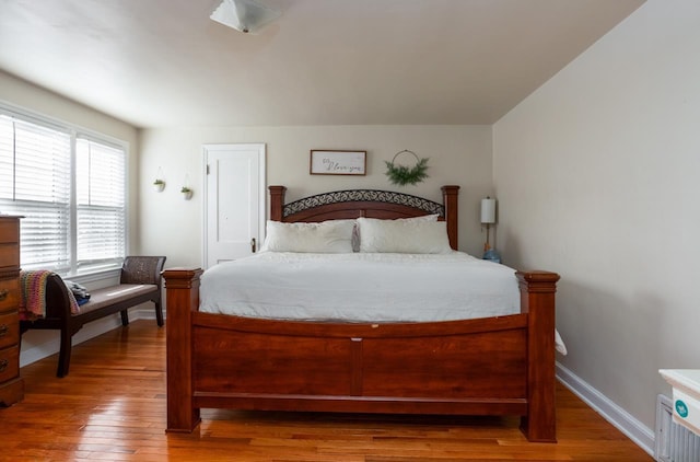 bedroom with hardwood / wood-style floors