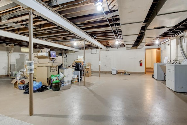 basement with washing machine and clothes dryer