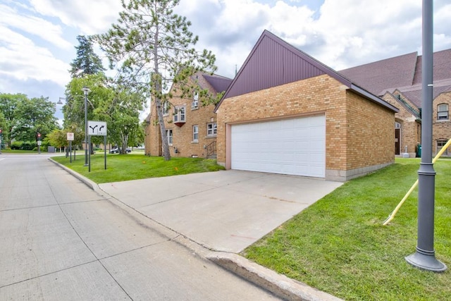 view of property featuring a garage and a front yard