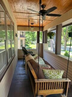 sunroom with wooden ceiling