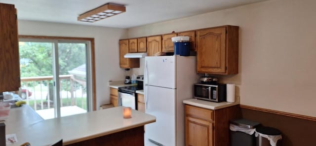 kitchen with kitchen peninsula and appliances with stainless steel finishes