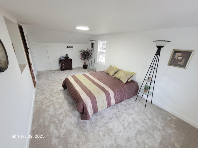 bedroom featuring light colored carpet