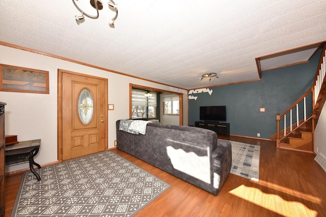 living room with crown molding and hardwood / wood-style floors