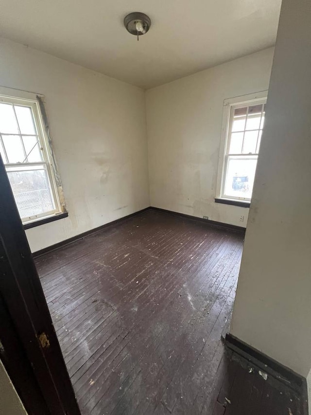 empty room featuring dark wood-type flooring