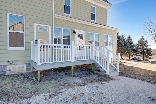 property entrance with a deck