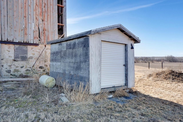 view of outbuilding featuring a rural view