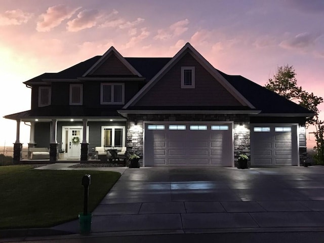 view of front facade featuring a garage and a porch