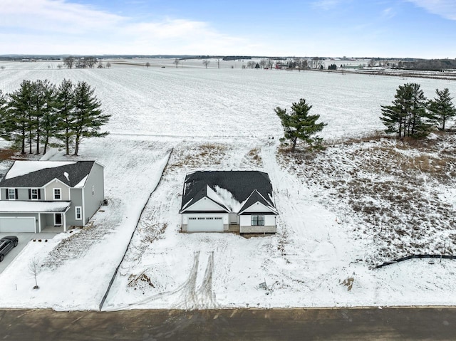 snowy aerial view with a rural view