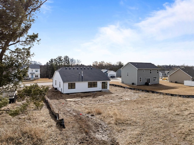 back of house featuring a residential view