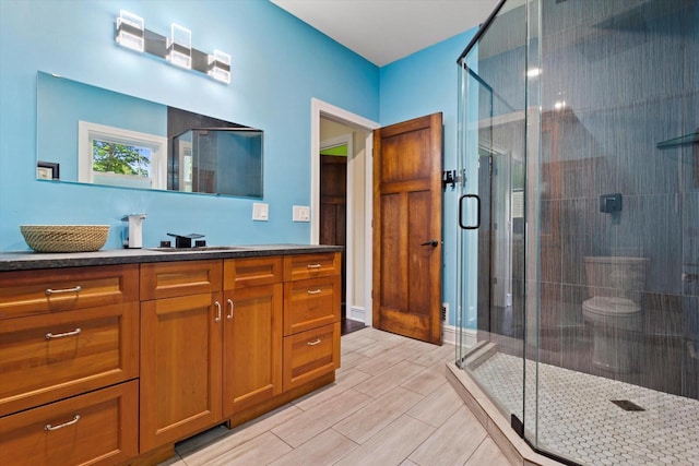 4922 W Dean Rd, Milwaukee, WI 53223 - bathroom with vanity, a shower stall, and wood tiled floors