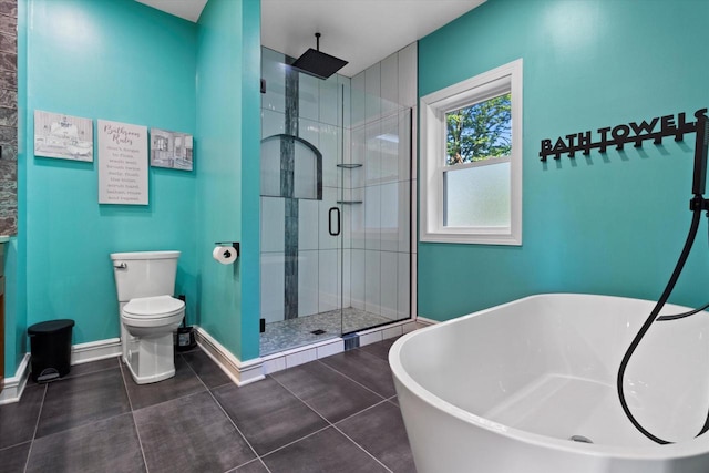 4922 W Dean Rd, Milwaukee, WI 53223 - bathroom with a stall shower, a freestanding bath, toilet, baseboards, and tile patterned flooring