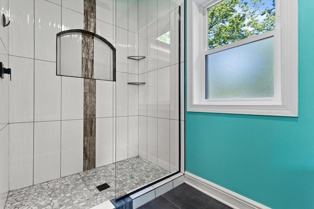4922 W Dean Rd, Milwaukee, WI 53223 - full bath featuring healthy amount of natural light, a shower stall, tile patterned floors, and baseboards