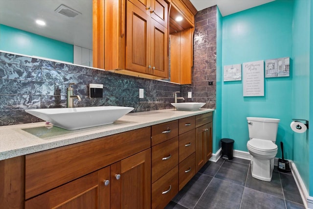 4922 W Dean Rd, Milwaukee, WI 53223 - full bath featuring baseboards, decorative backsplash, tile patterned flooring, toilet, and double vanity