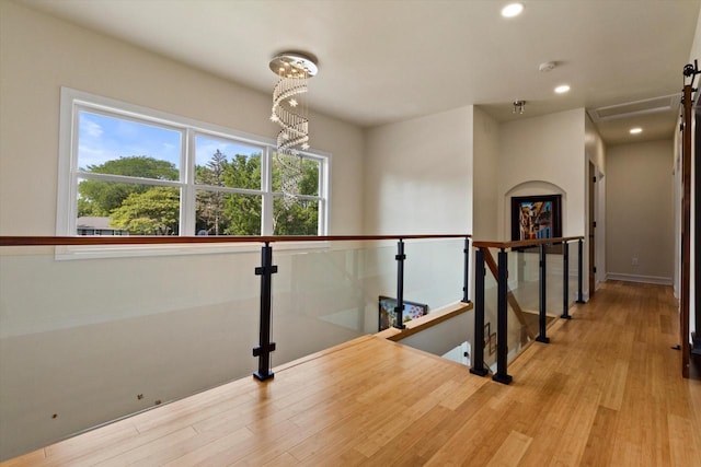 4922 W Dean Rd, Milwaukee, WI 53223 - hallway with an upstairs landing, wood finished floors, recessed lighting, and baseboards