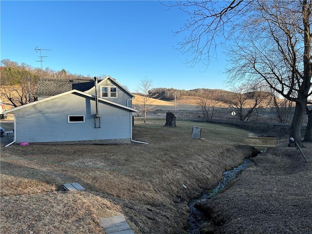 view of home's exterior featuring a lawn