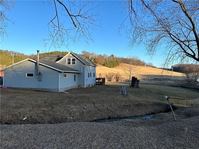 view of property exterior with a yard