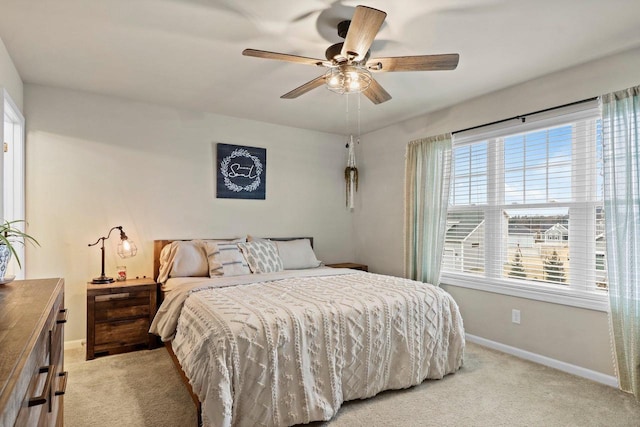 bedroom with light colored carpet and ceiling fan