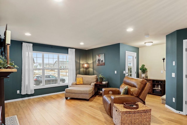 living area with light hardwood / wood-style floors