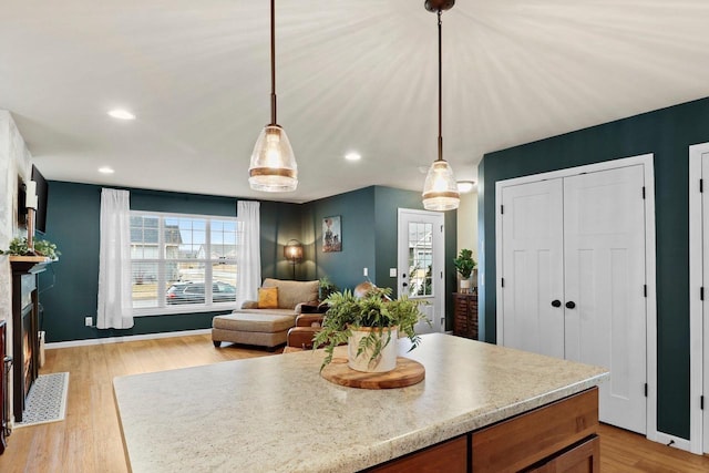 kitchen featuring pendant lighting and light wood-type flooring