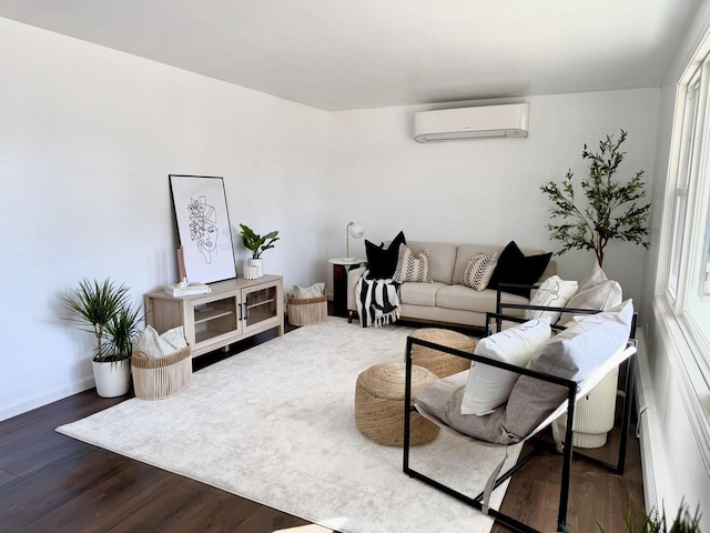 living room featuring dark hardwood / wood-style floors and an AC wall unit