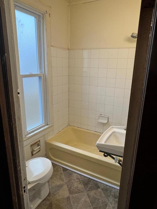 bathroom featuring sink, tile patterned floors, and toilet