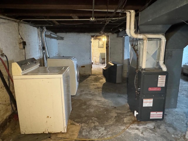 basement with separate washer and dryer and heating unit