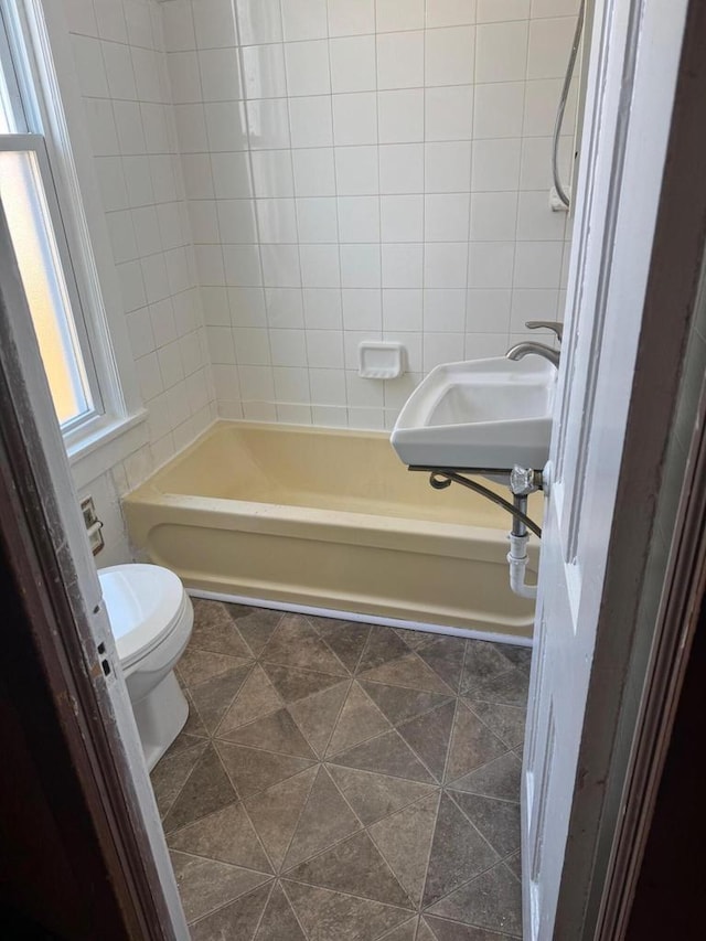 1820 54th St, Kenosha, WI 53140 - full bathroom featuring bathtub / shower combination and tile walls