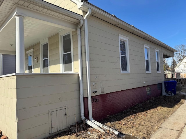 view of side of property with a porch