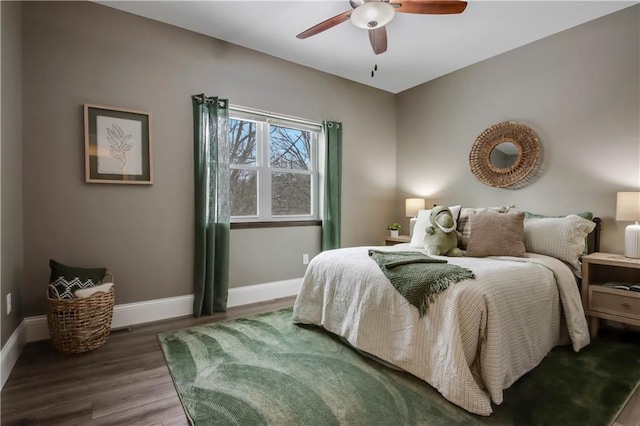 bedroom with dark wood-type flooring and ceiling fan