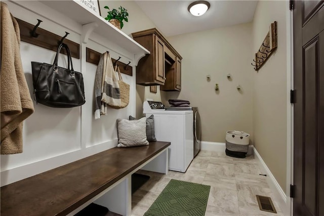 mudroom featuring washing machine and dryer