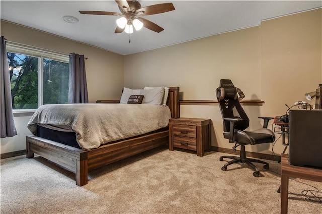 bedroom featuring ceiling fan and light carpet